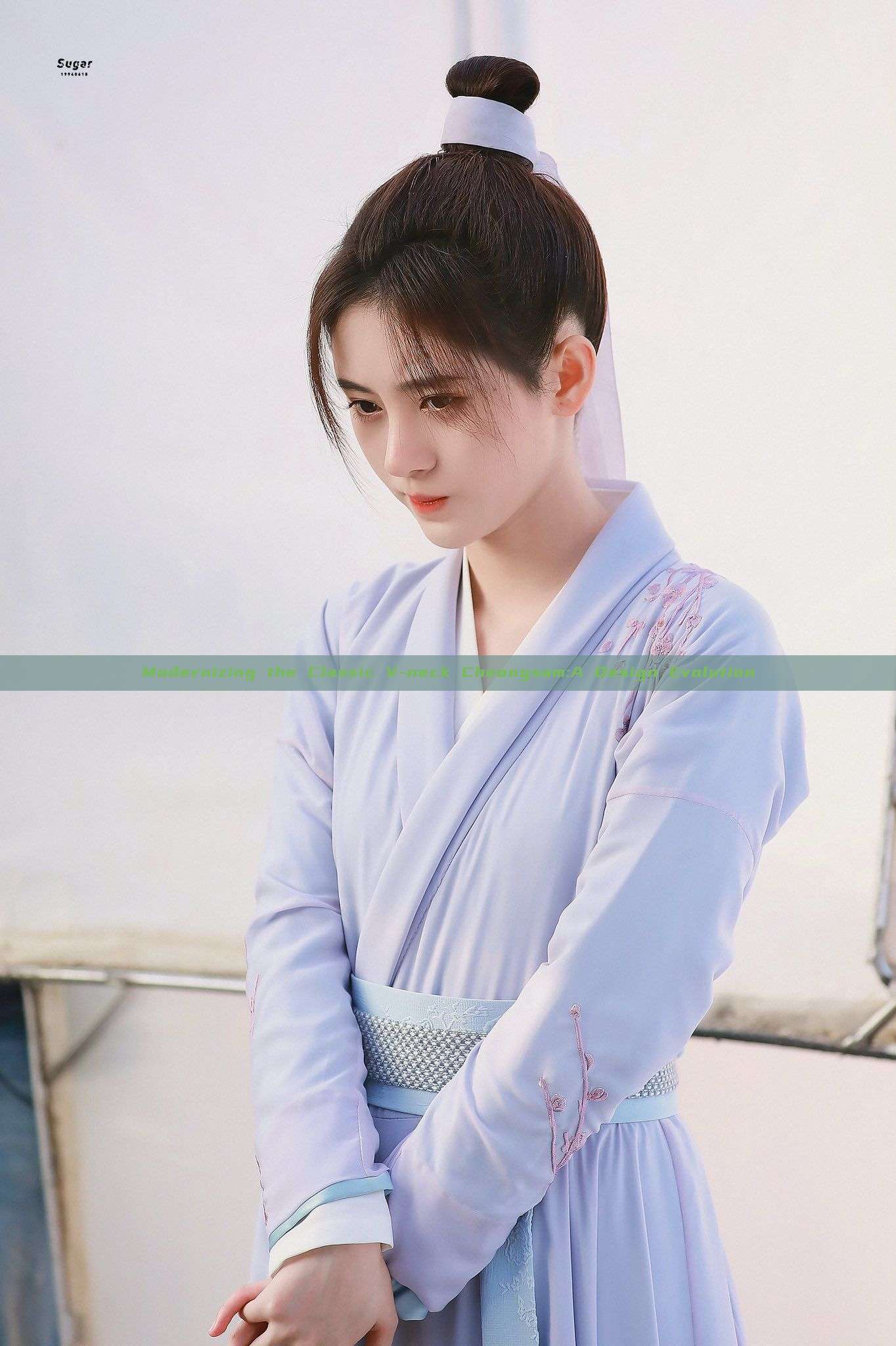 Modernizing the Classic V-neck Cheongsam:A Design Evolution